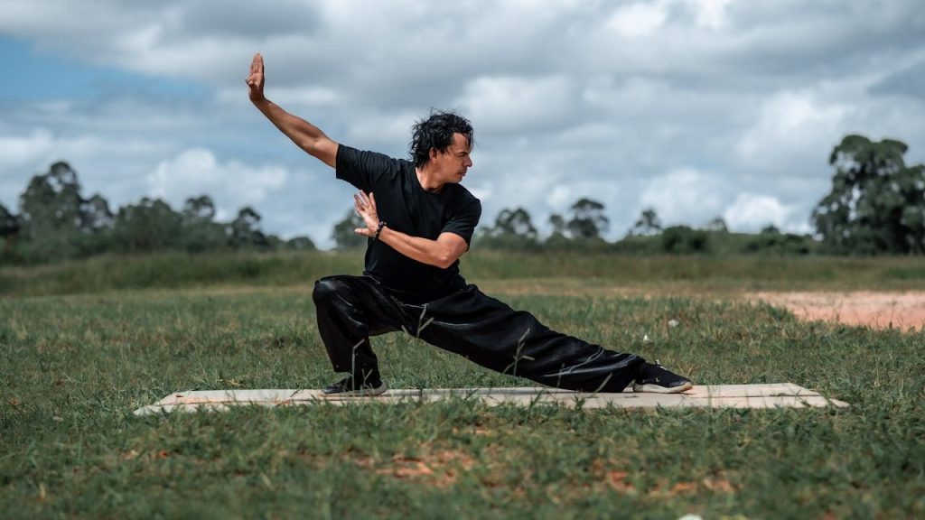 Man in Black Outfit Practicing Tai-chi